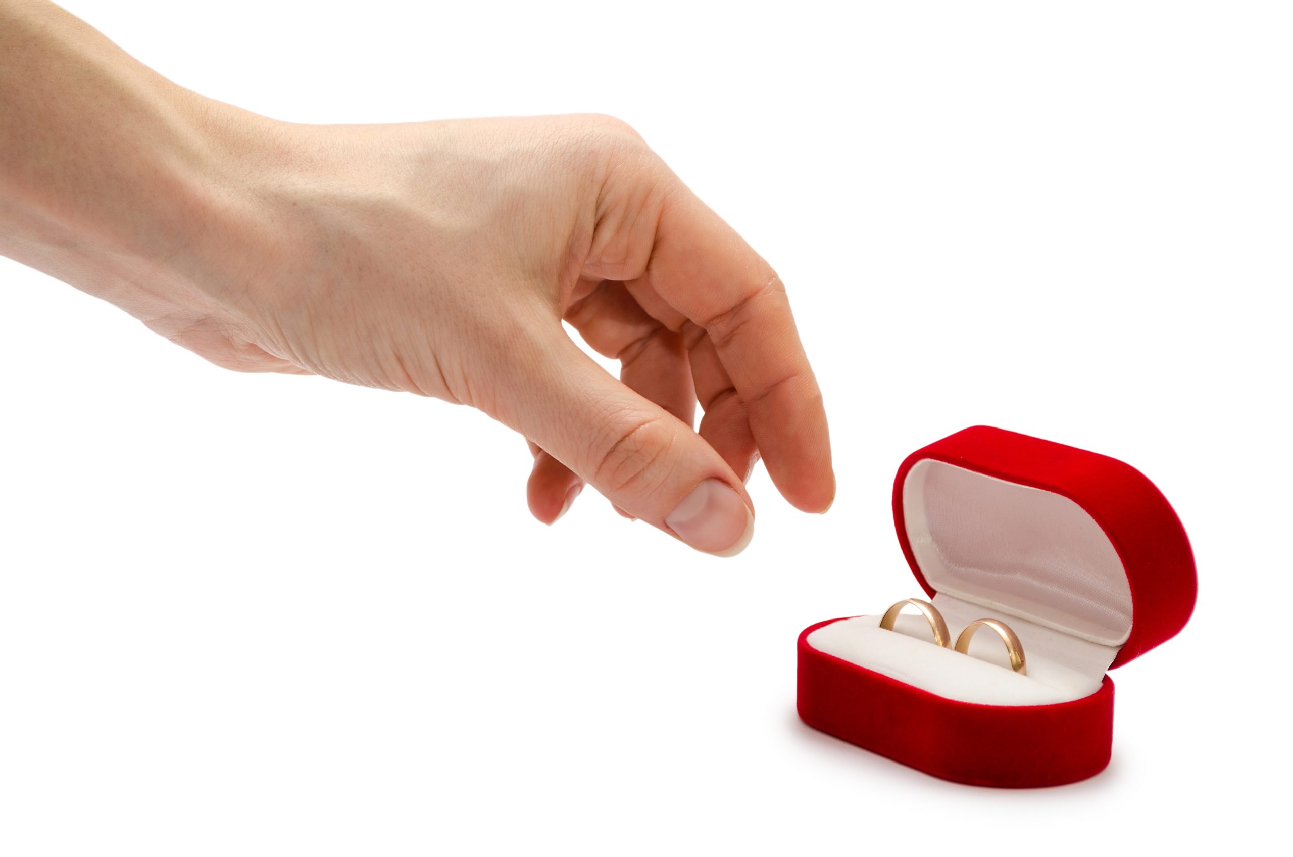 woman reaching for engagement rings